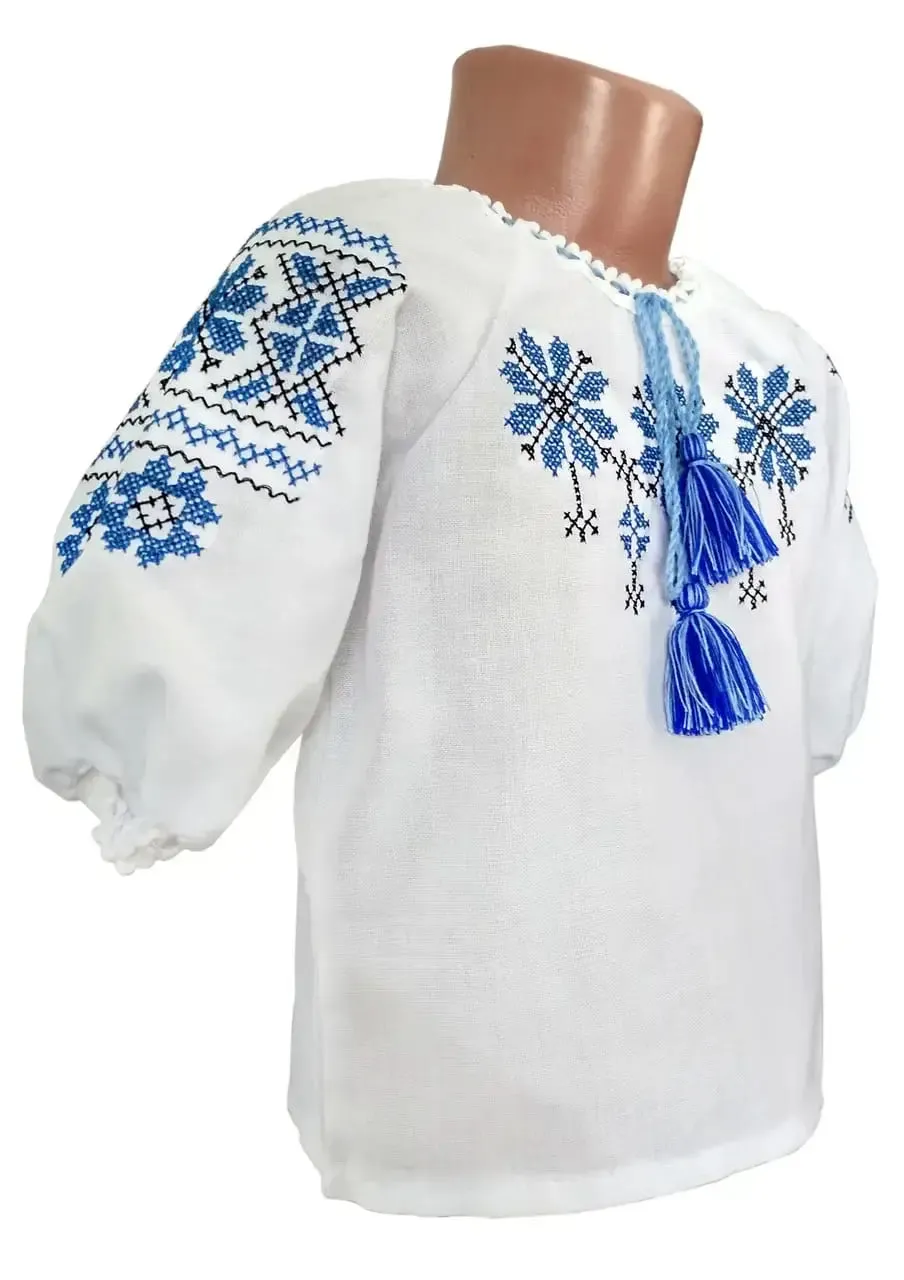 Embroidered blouse for a girl with a geometric ornament